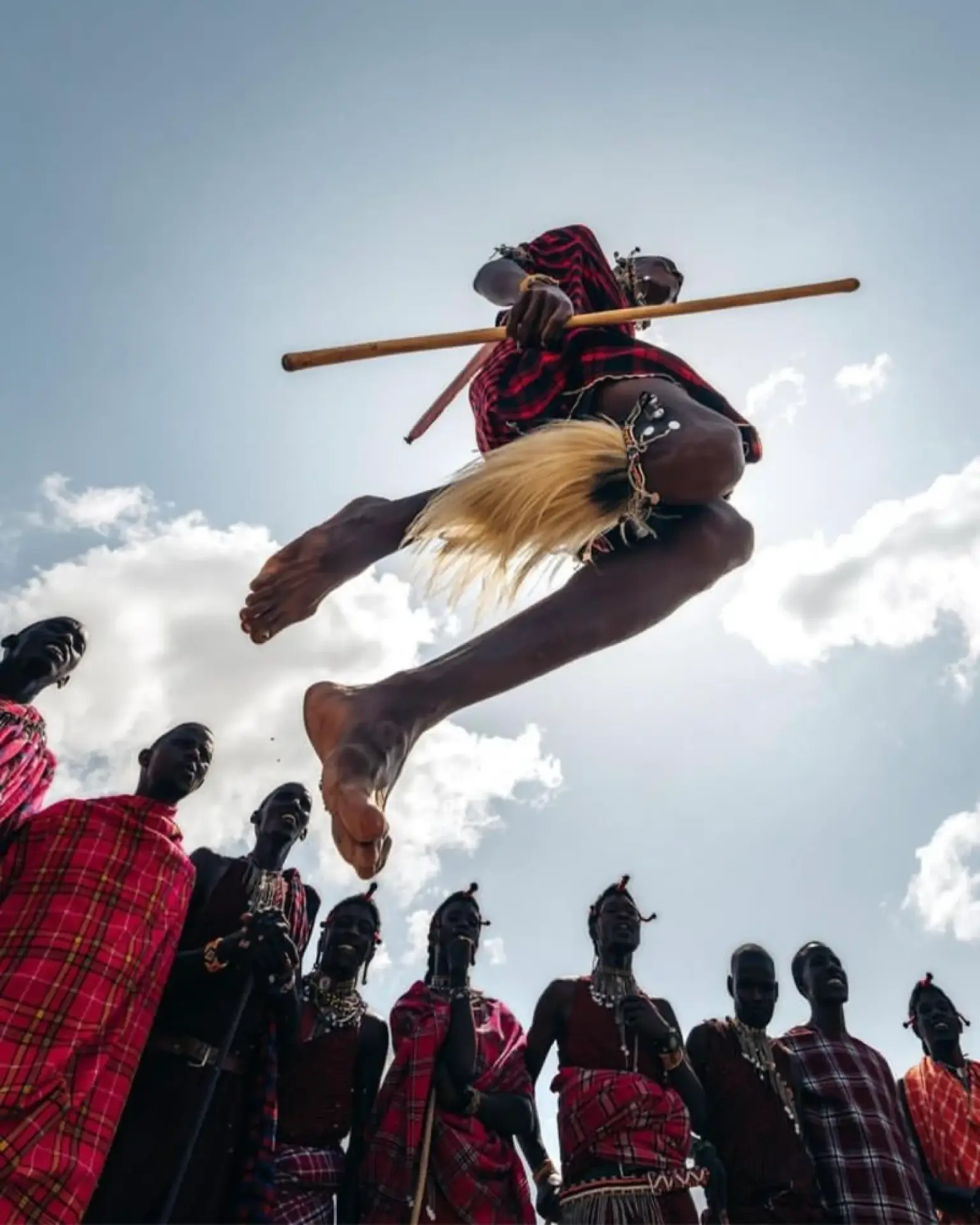 Maasai warrior leaping high during the traditional jumping dance