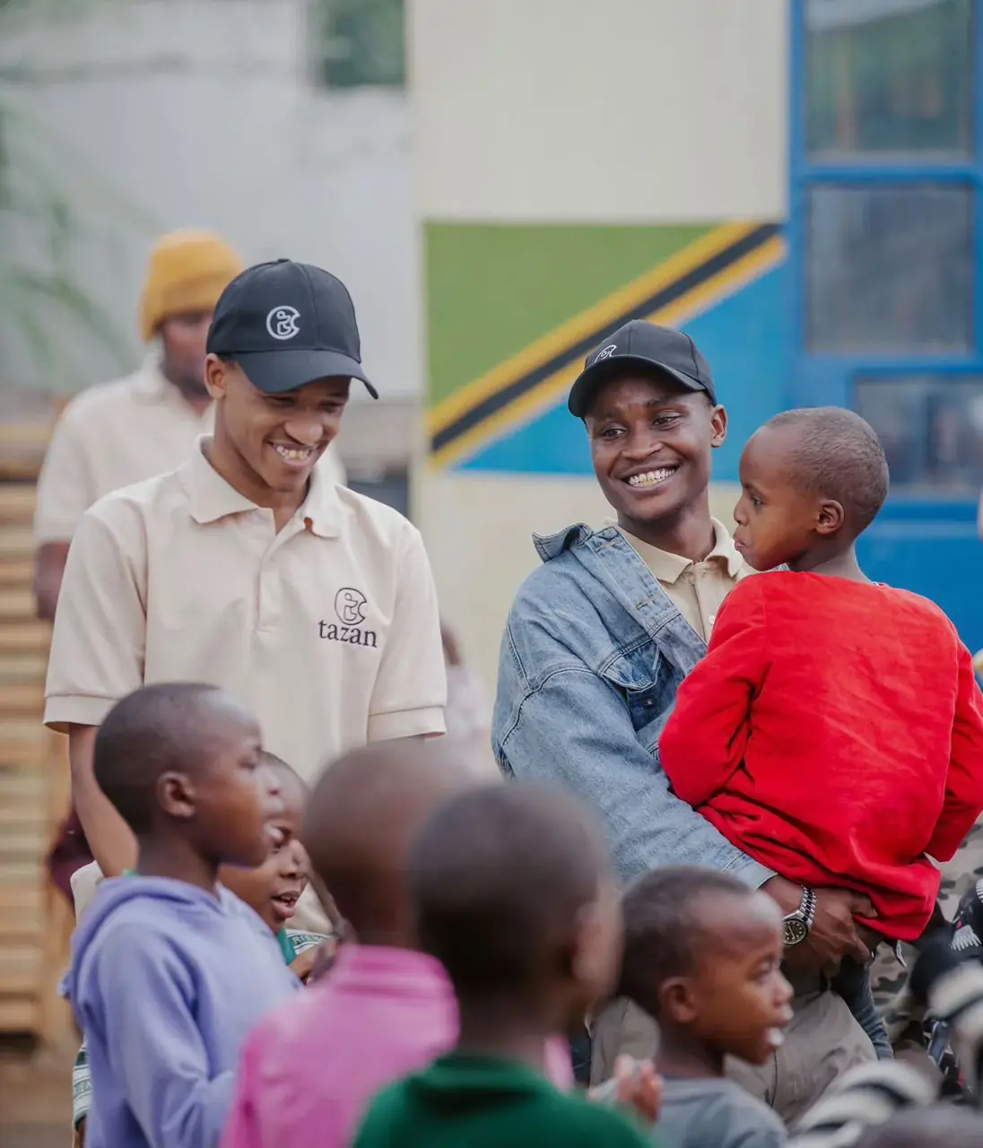 Tazan Foundation team members with children in the community