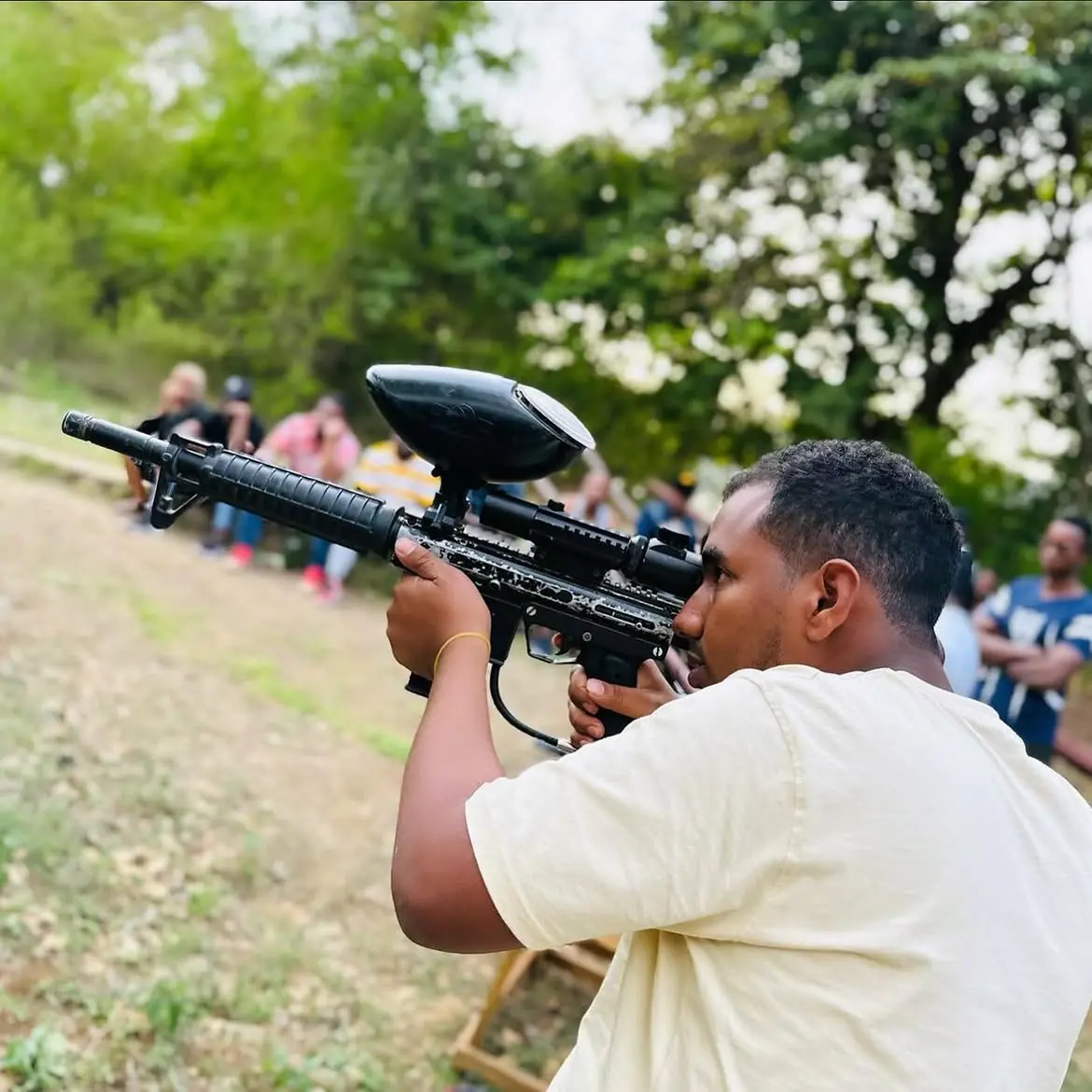 Guests on a paintball activity with the Tazan Tours team