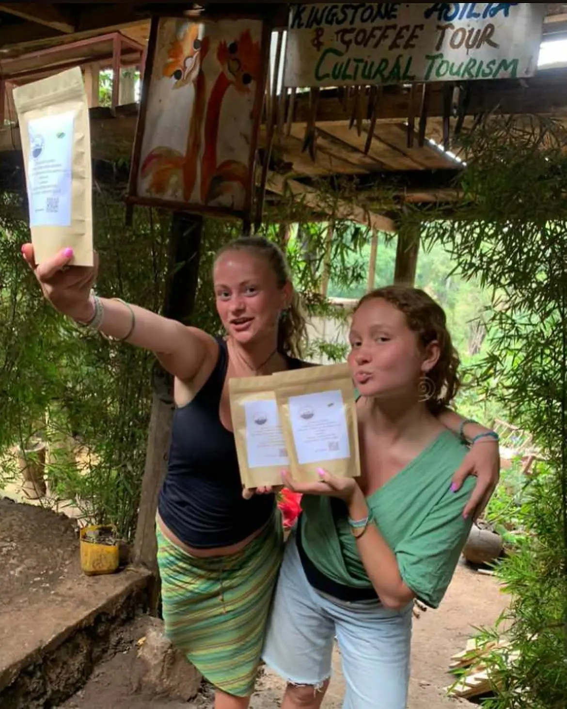 Guests holding coffee they picked up on a cultural tourism and coffee tour