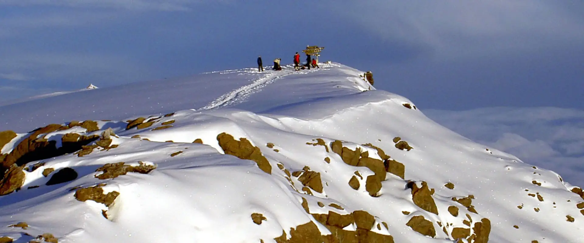 Climbers on the snow-covered summit ridge of Kilimanjaro