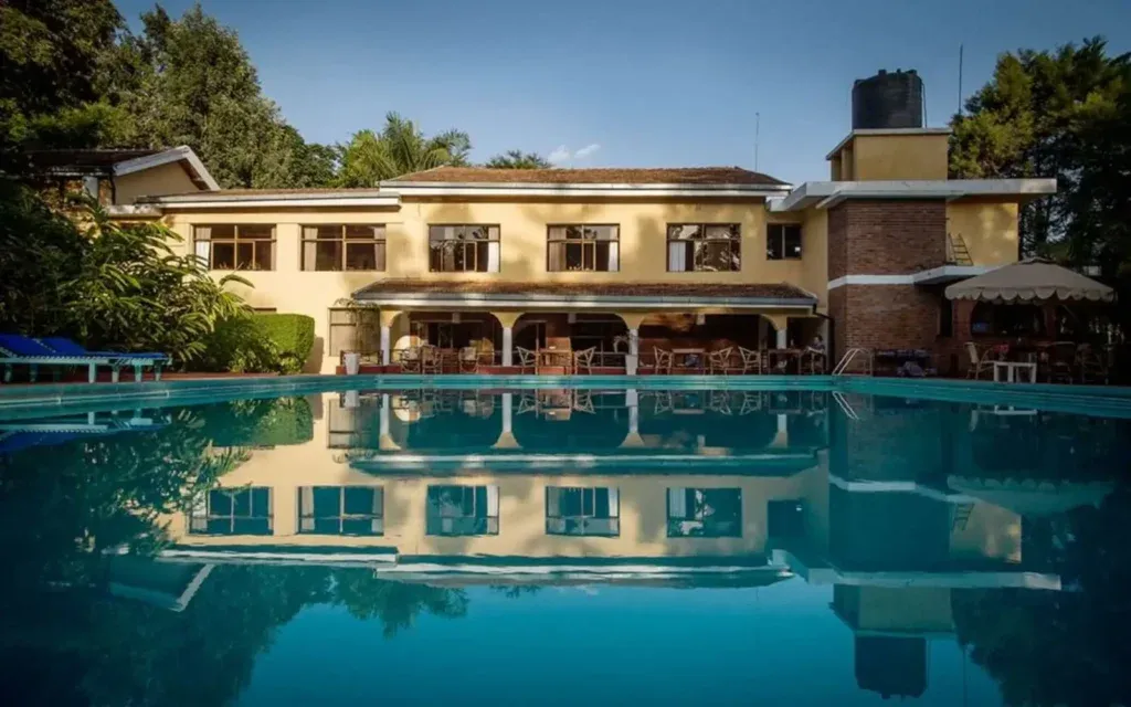 Ilboru Safari Lodge main house reflected in the swimming pool, Arusha