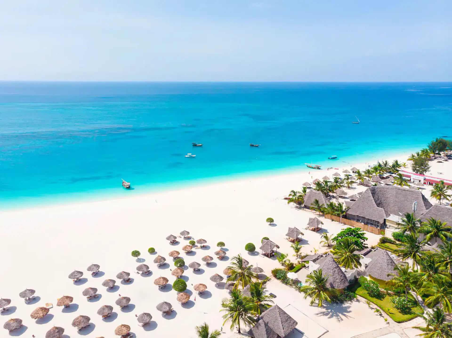 Aerial view of a white sand beach and turquoise water in Zanzibar